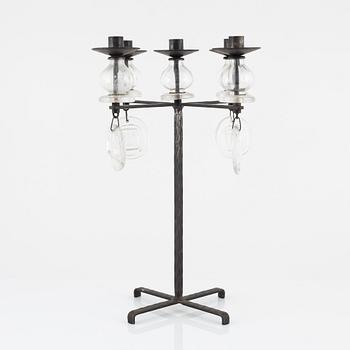 Erik Höglund, a iron and glass candelabra.