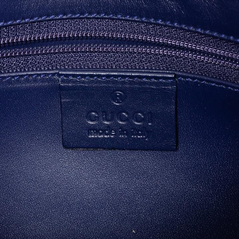 Gucci, a blue leather and fabric bag.