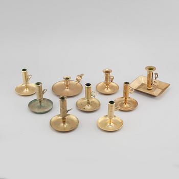 Nine brass candlesticks, 20th century.