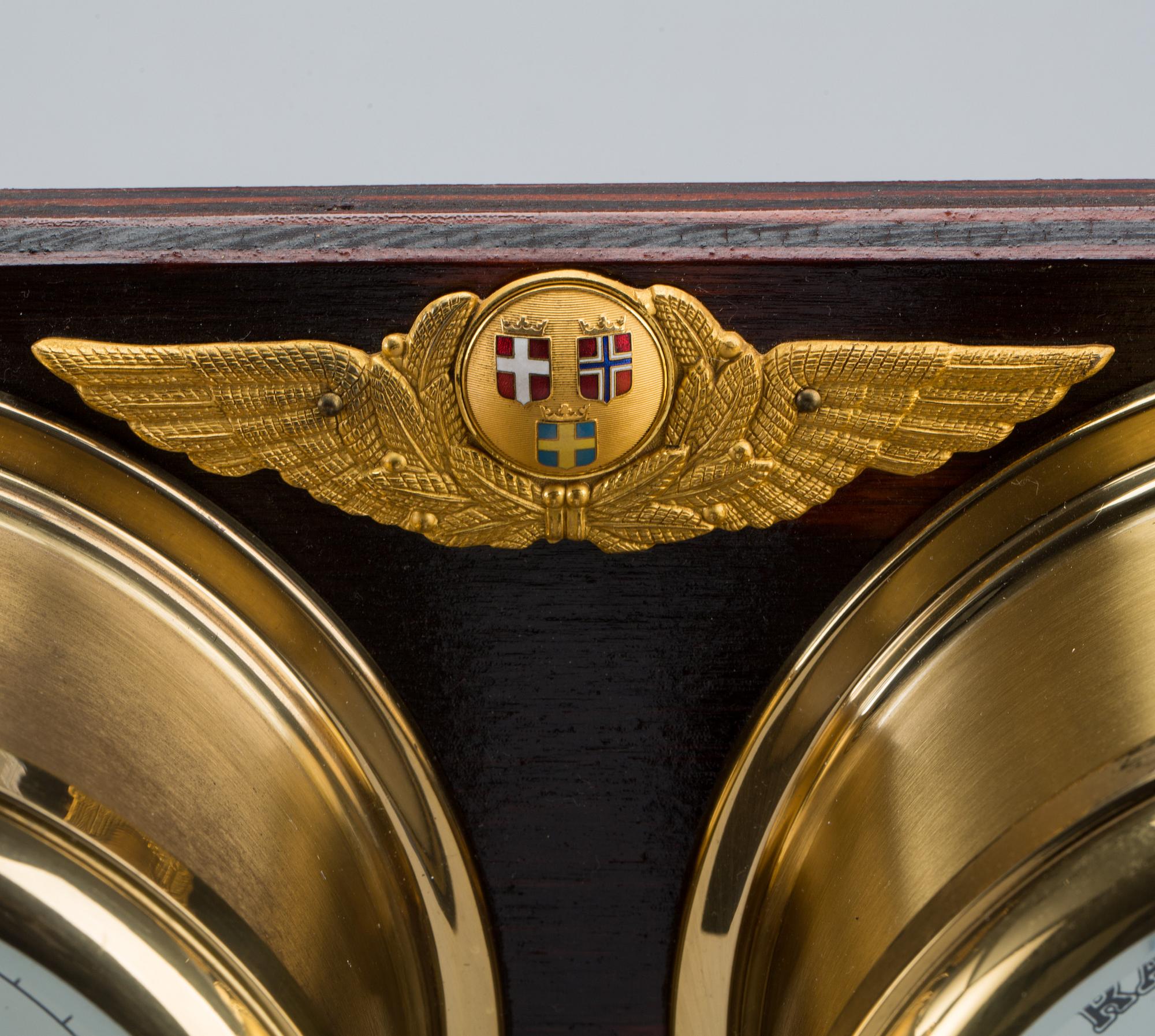 A BRASS MARINE CLOCK AND BAROMETER BY STOCKBURGER.