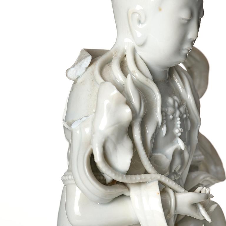 A large blanc-de-chine figure of Guanyin riding an elephant, late Qing dynasty/early 20th Century.