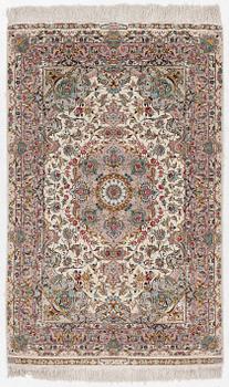 A Tabriz rug, signed, c. 160 x 101 cm.