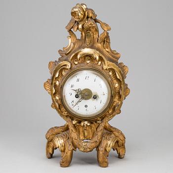 A swedish rococo gilt wood mantle clock.