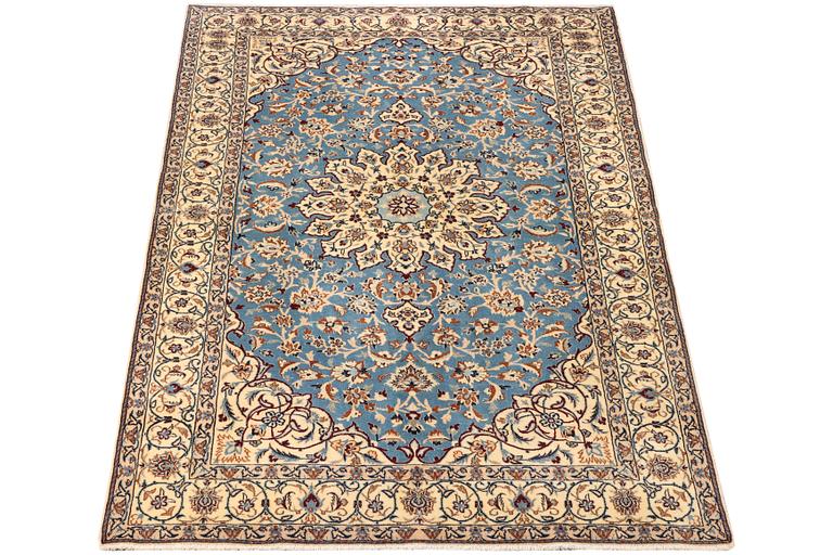A Nain, part silk carpet, c. 196 x 120 cm.