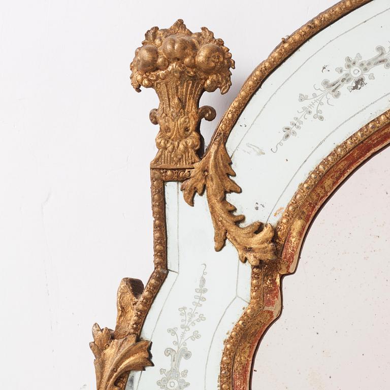 A Baroque gilt-lead and engraved glass mirror by Burchardt Precht (active in Stockholm 1674-1738).
