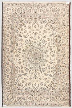 A carpet, Nain, part silk s.k 9LAA. Circa 376 x 249 cm.