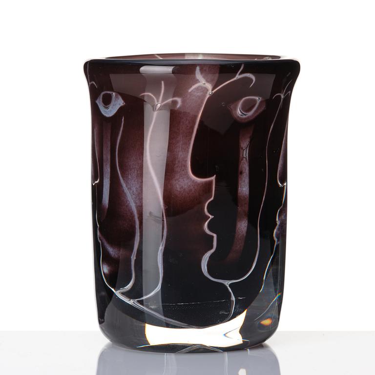 Ingeborg Lundin, an 'ariel' burgundy coloured glass vase decorated with faces, Orrefors Sweden 1972.
