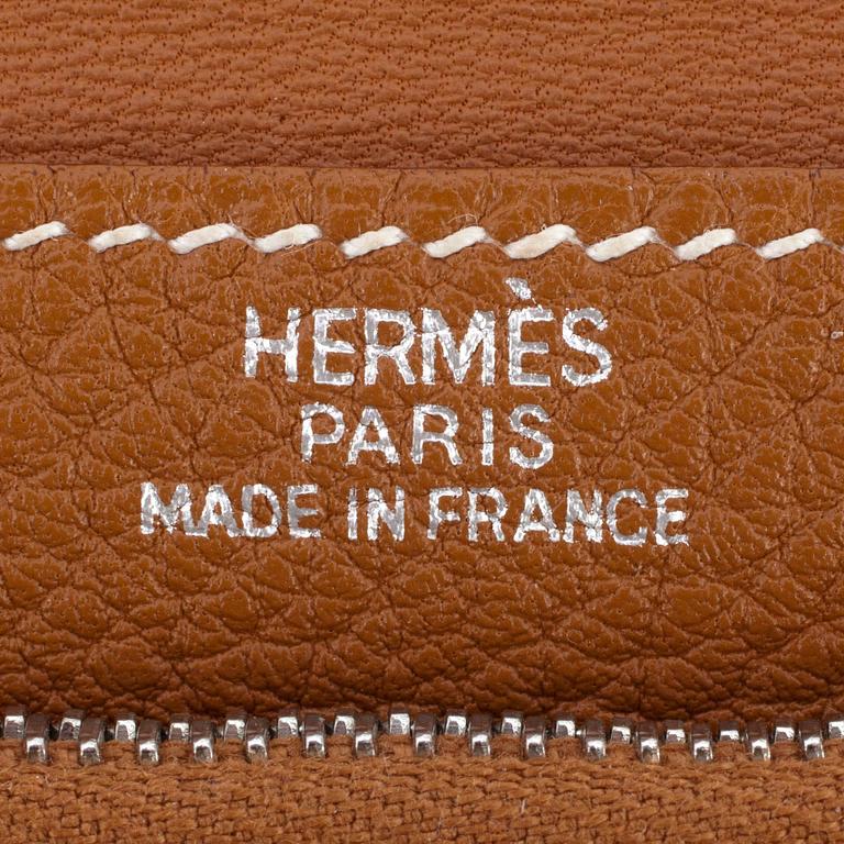 HERMÈS, a brown leather wallet, "Dogon".