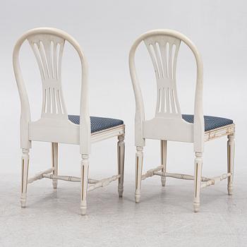 A Gustavian style dining table with ten chairs, Sweden, mid/second half of the 20th century.