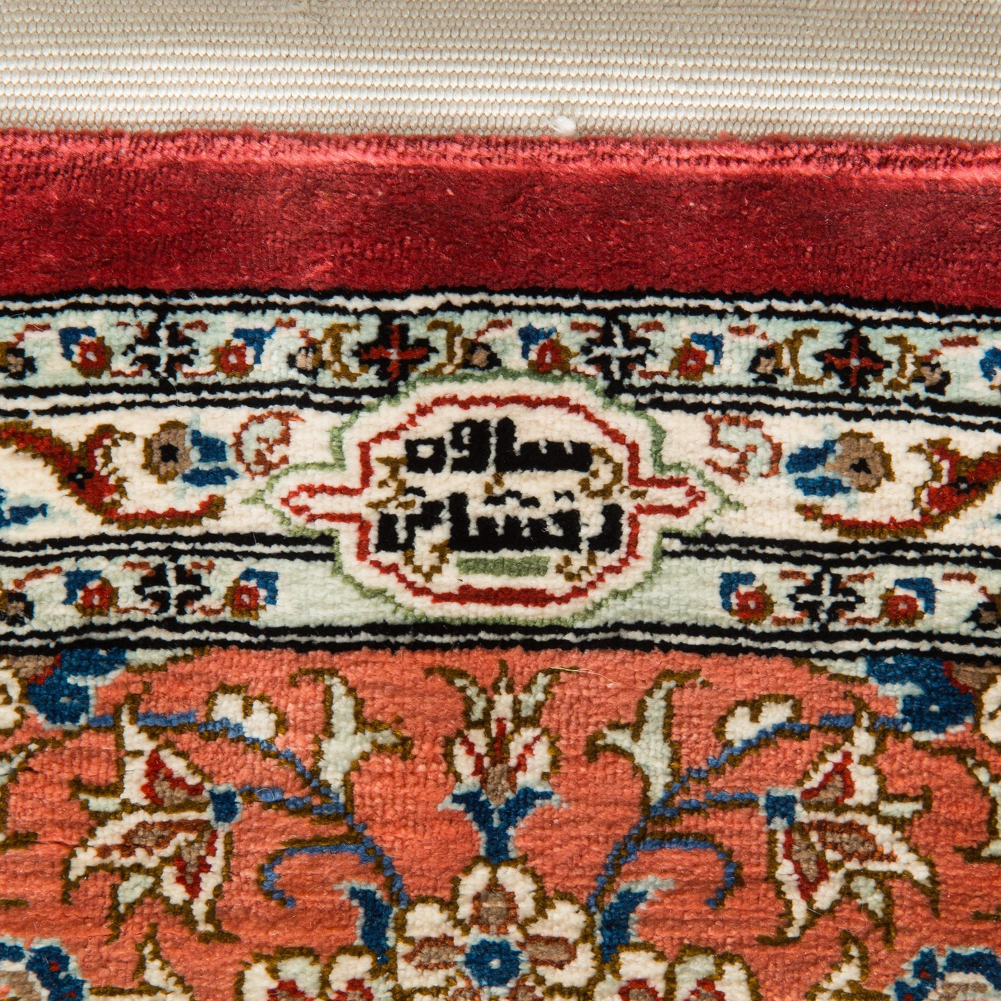A silk Qum rug, circa 152 x 101 cm.