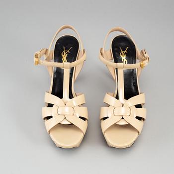 YVES SAINT LAURENT, a pair of open toe patent leather shoes, size 36½.