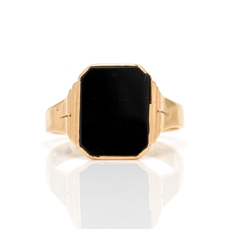 A signet ring set with onyx.