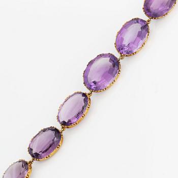 A 14K gold and amethyst necklace.