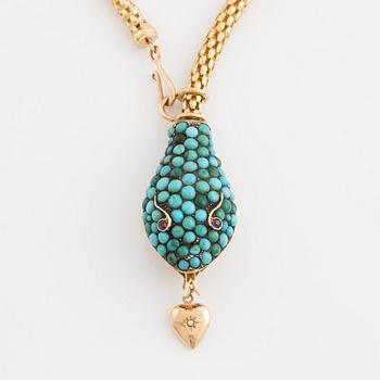Necklace in gold in the shape of a serpent with turquoise and rubies.
