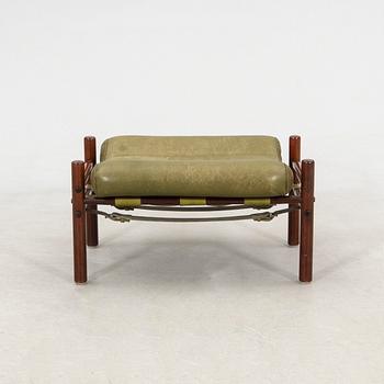 Arne Norell, a pair of armchairs and a footstool "Inca", Norell Möbel AB, second half of the 20th century.