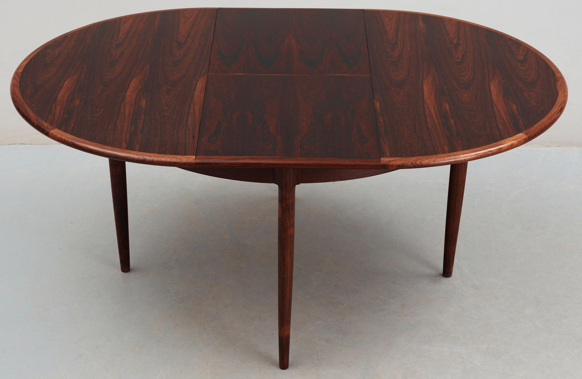 A Niels Ole Møller palisander dining table and and five chairs, J.L. Møller, Denmark 1950's-60's.
