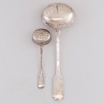 A Russian silver soup ladle and sugar caster by Sasikov, Saint Petersburg 1869.