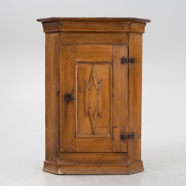 A 18th century corner cabinet.