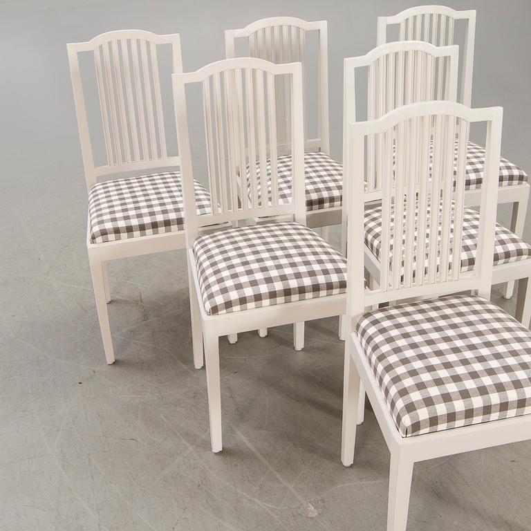 A set of six painted chairs around 1900.