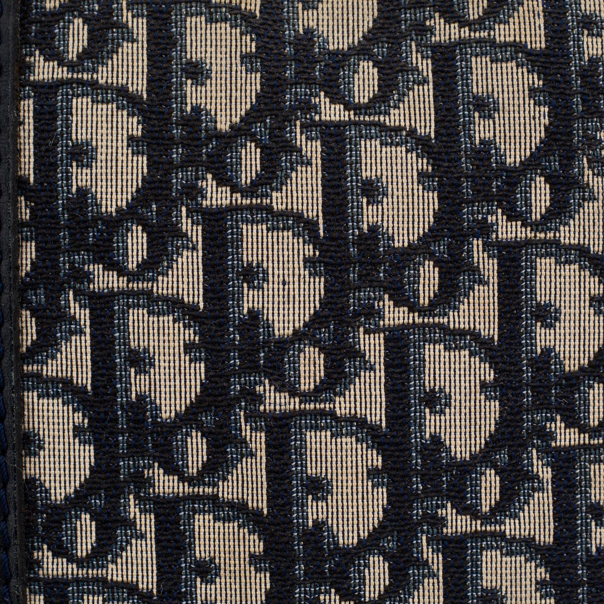 Christian Dior, a canvas handbag, toilet bag and key holder.