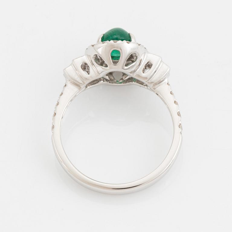 Cabochon cut emerald, baguette and brilliant cut diamond ring.