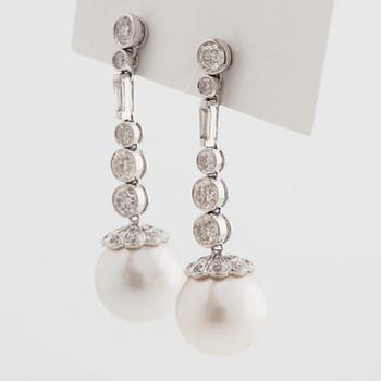 A pair of cultured south sea pearl and brilliant cut diamond earrings. Total carat weight of diamonds circa 3.30 cts.