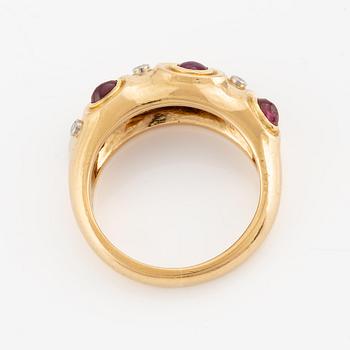 A W.A. Bolin ring in 18K gold with cabochon-cut rubies and eight-cut diamonds.