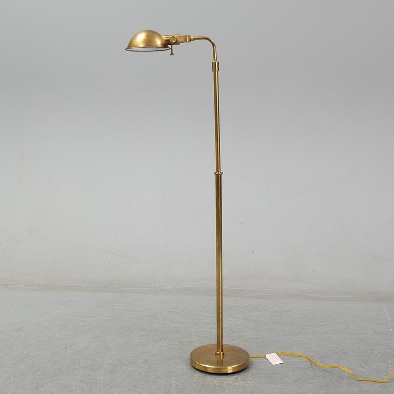 Ralph Lauren, A brass floor lamp.