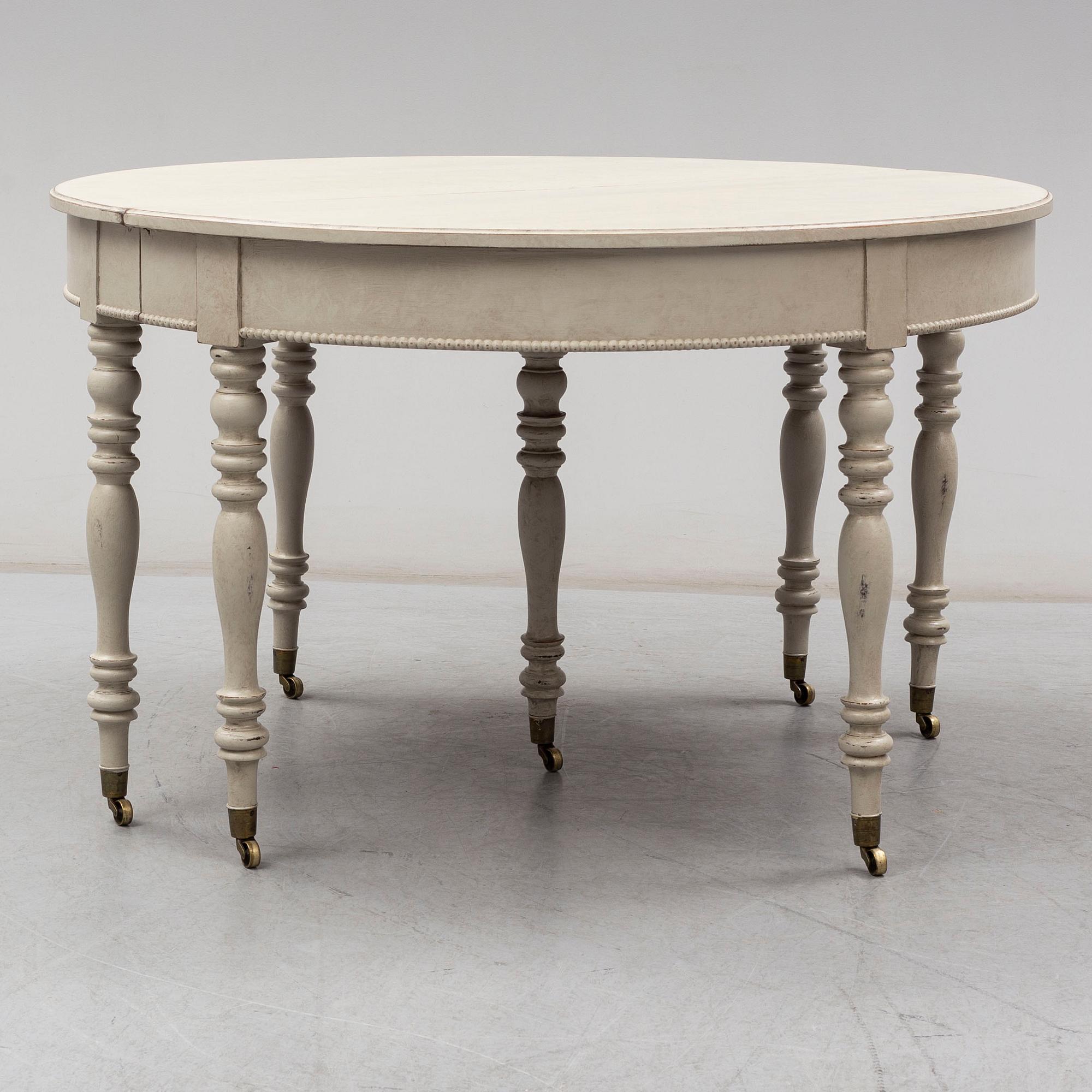 A mid 19th century painted dining table.