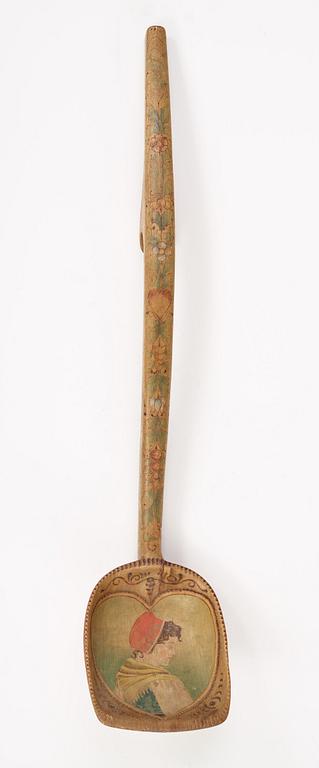 a swedish wooden ladle dated 1903.