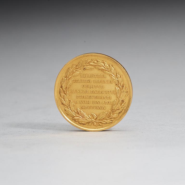 A Russian 19th century gold medal with Nicholas I (1825-1855).