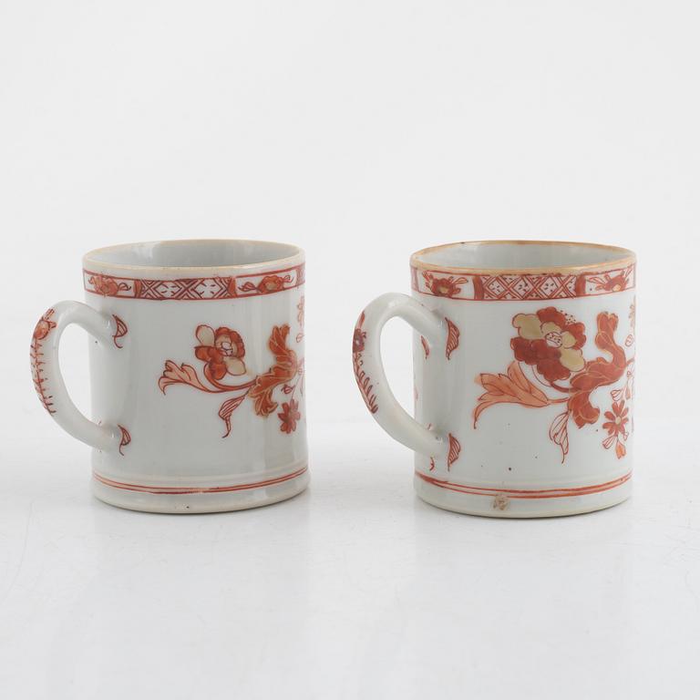 A pair of cups with ears and a cup with saucer, porcelain, -china, Qing dynasty, 18th century.