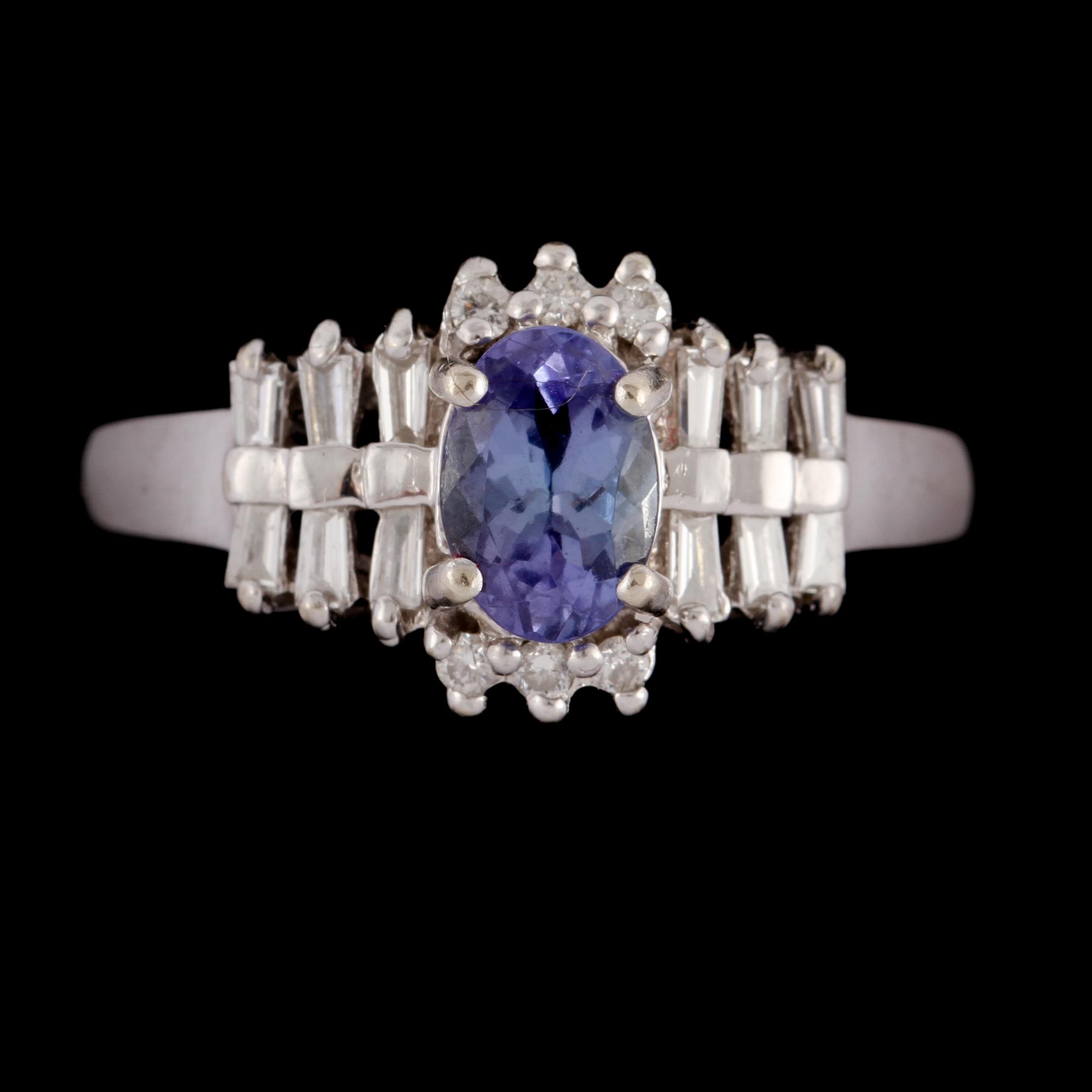RING, 14k vitguld med fasettslipad tanzanit 1.00 ct samt 12 trapets och 6 briljantslipade diamanter, tot 0.50 ct. Vikt 4.