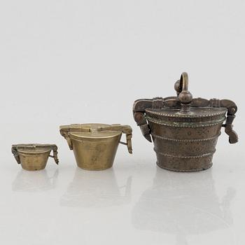 A set of three Nuremberg brass nested cup weights, one by Christoph or Johan Conrad Schön (masters 1746(1750).