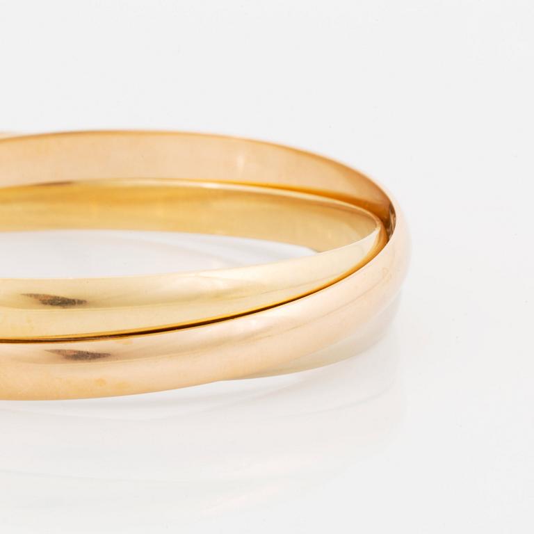 A Cartier "Trinity" bracelet in 18K gold.