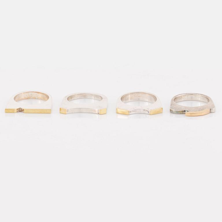 Rolf Karlsson four silver rings with gold details.