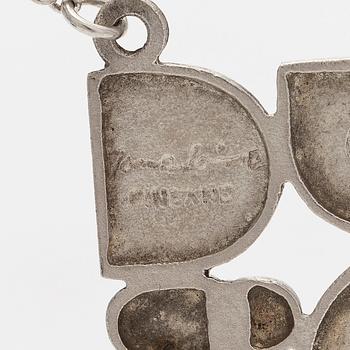 Jorma Laine, riipus, viistehiottu spektroliitti, hopea, Turun Hopea, Turku 1975.