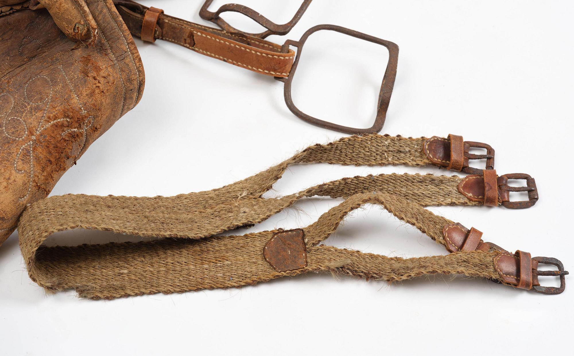 A leather saddle of Caucasian type, dated 1821.
