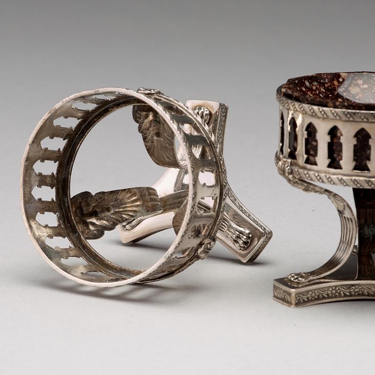 A pair of Swedish 19th century porphyry and silver salt-cellars, silver with mark of Gustaf Folcker, Stockholm 1823.