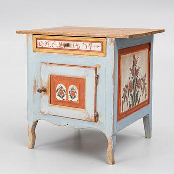 A Swedish folk art polychrome-painted table from Järvsö, Hälsingland, dated 1834.