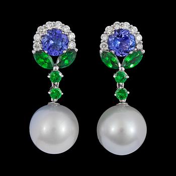 975. A pair of cultured South sea pearl, tanzanite, tsavorite and brilliant cut diamond earrings, tot. 0.70 cts.