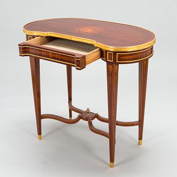 A Directoire style marquetry table from around year 1900.