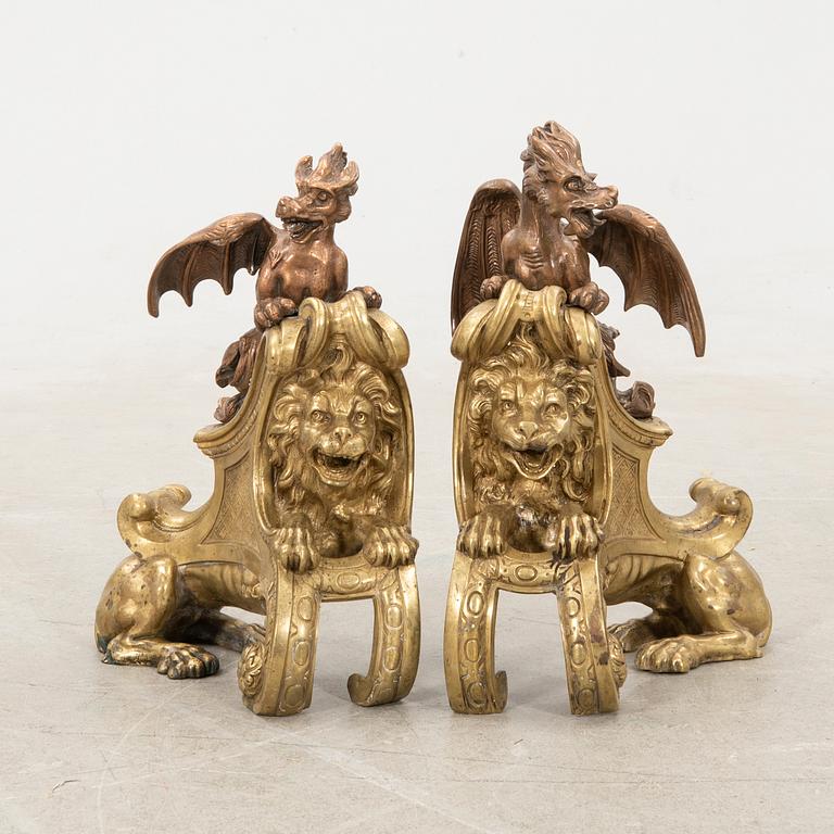 Fire dogs a pair of Baroque style 20th century in the manner of Charles Cressent.