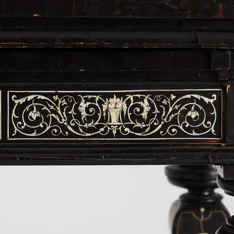 A Renaissance-style ebony, ebonized and ivory-inlaid library table, late 19th century, presumably Germany.