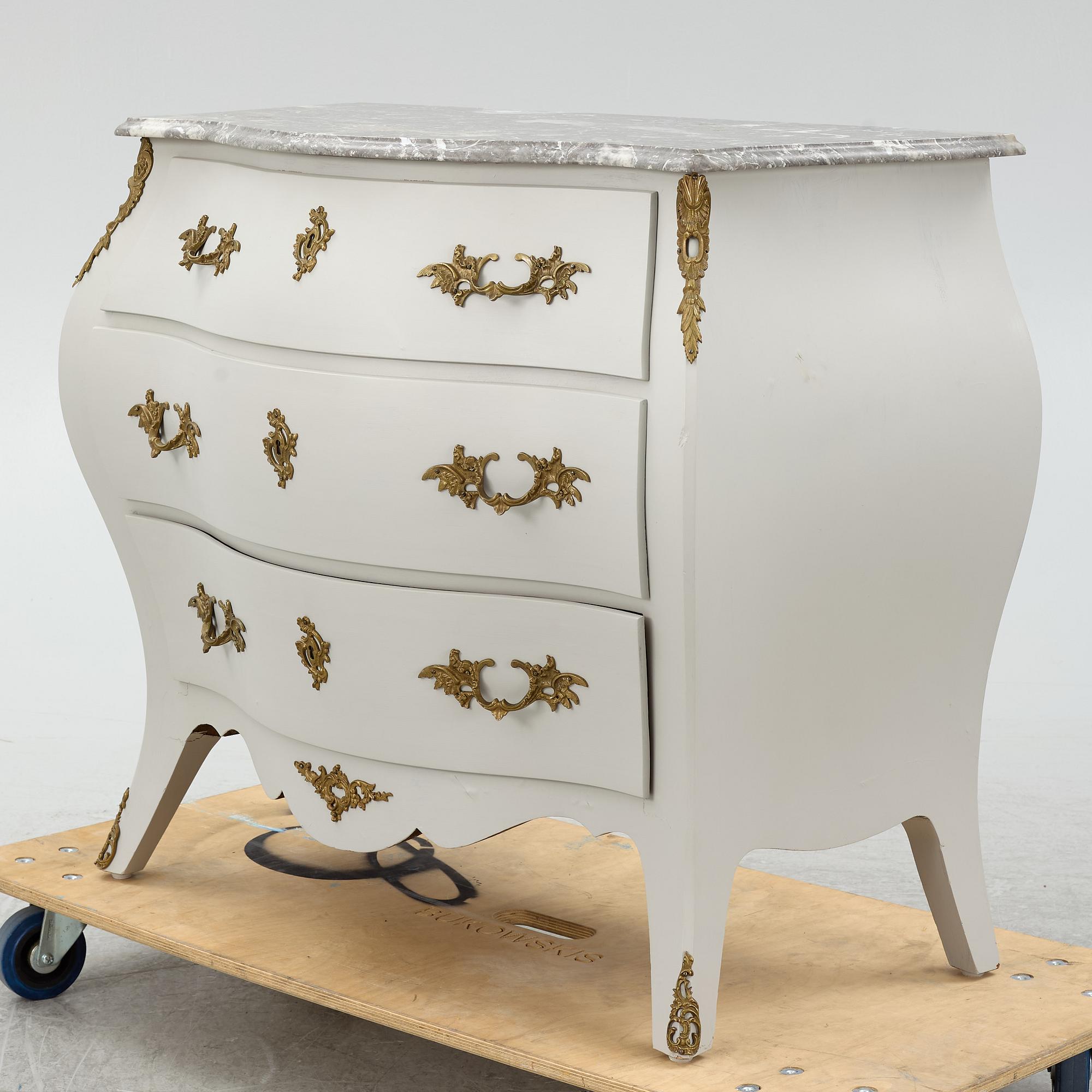 A Rococo style chest of drawers, mid-20th Century.