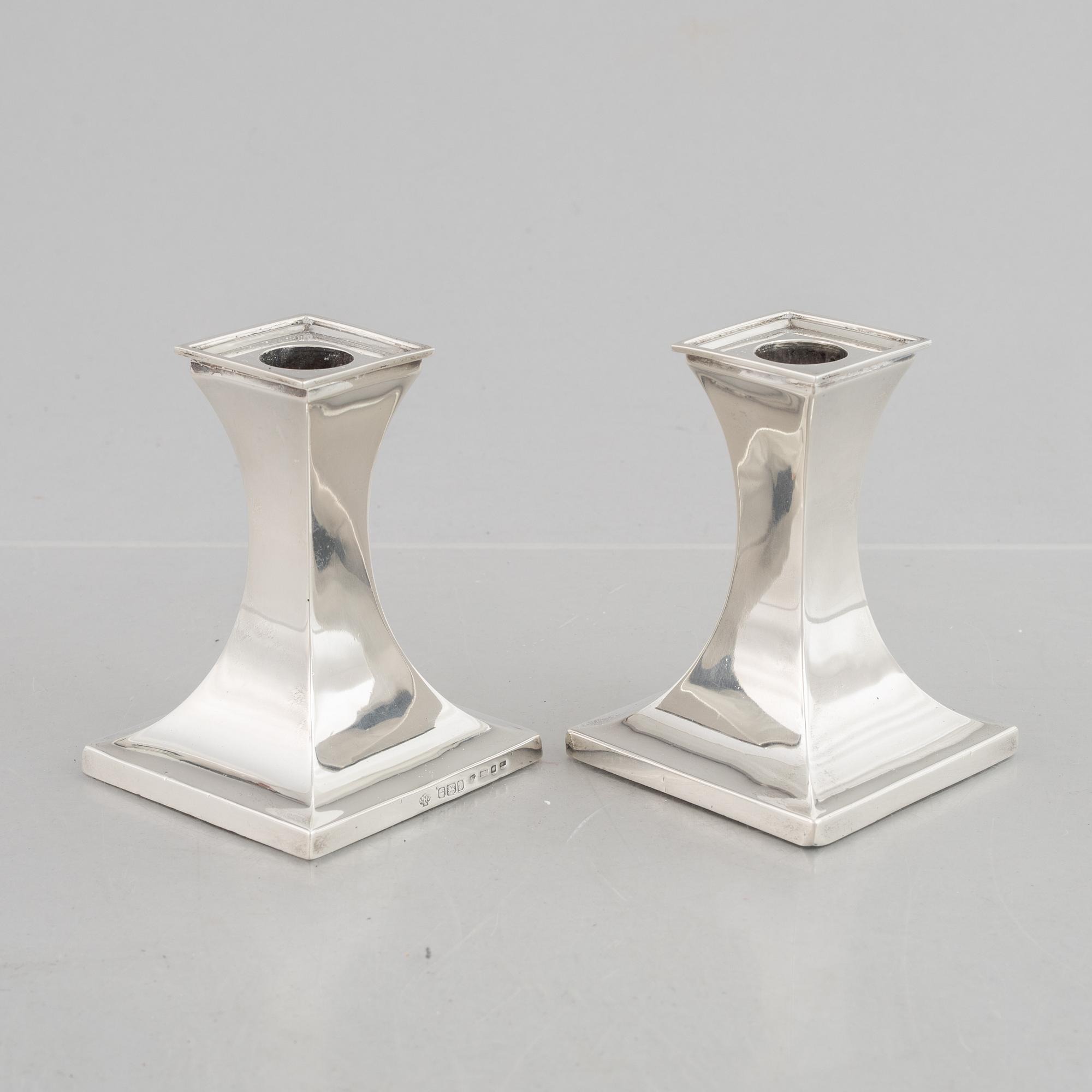 A pair of silver candlesticks, mark of William Hutton & Sons Ltd, Sheffield 1911-1912.