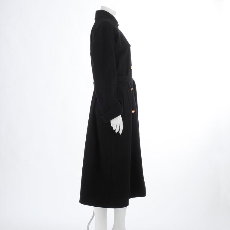 CÉLINE, a black cashmere and wool coat.