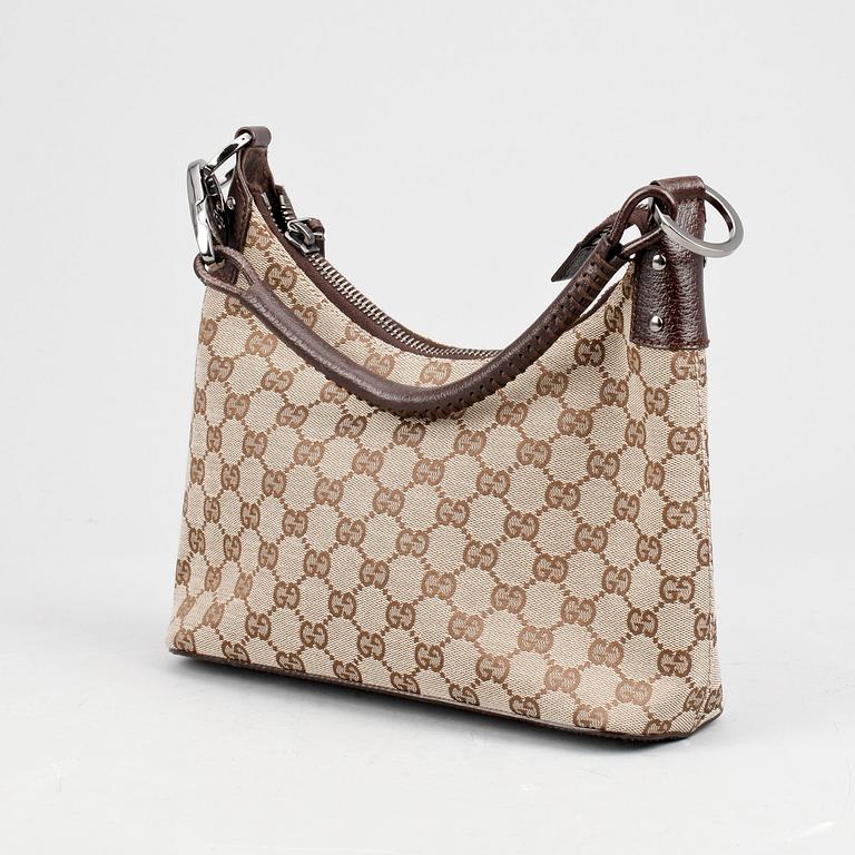 GUCCI, a beige monogram canvas shoulderhandbag.