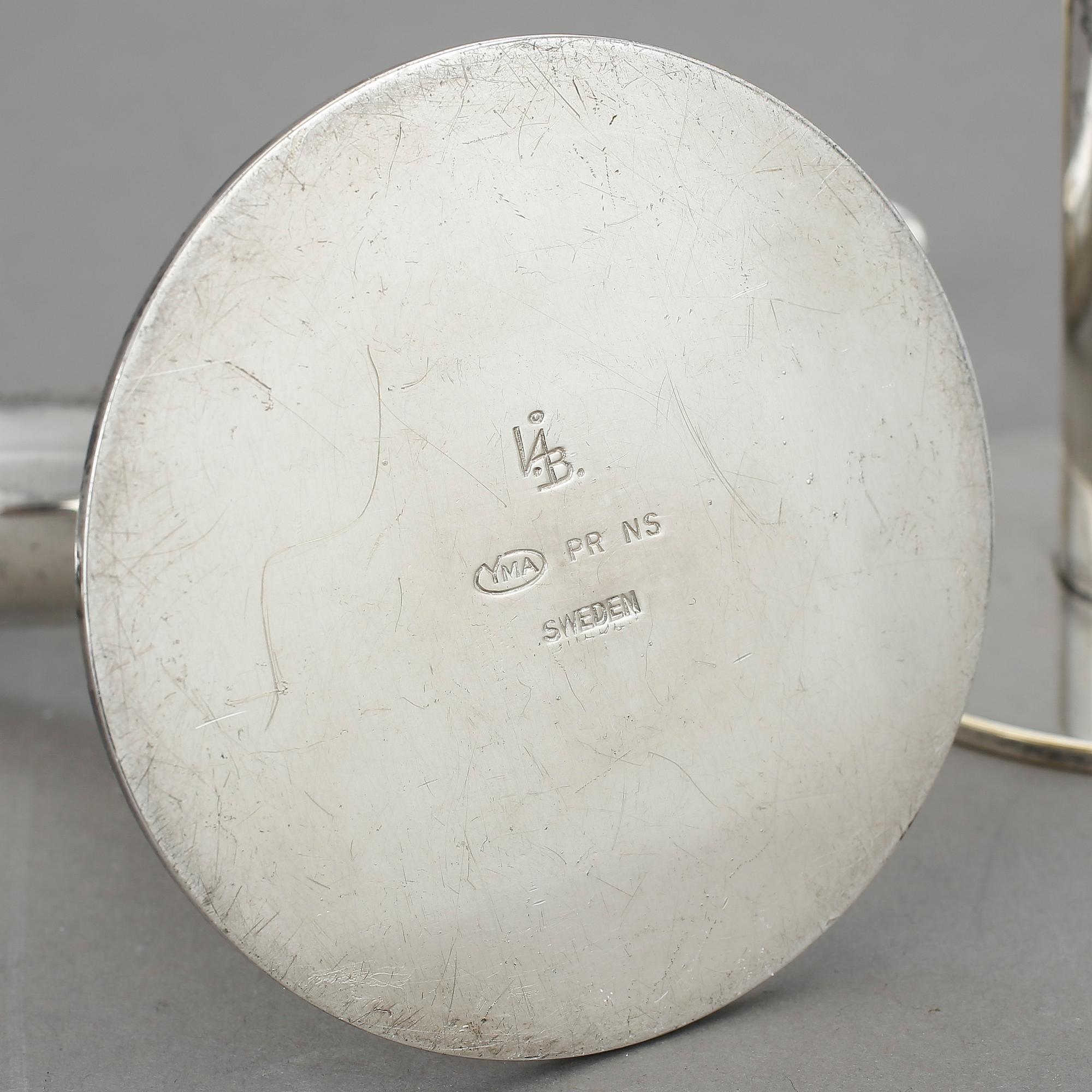 LJUSSTAKAR, ett par, nysilver, "Liljan", Ivar Ålenius Björk, Ystad metall, 1900-tal.