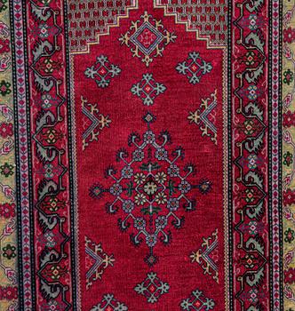 A rug, Oriental silk, ca 141 x 70 cm.